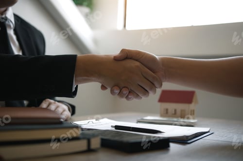 Preview: Home sales agents and buyers work on signing new homes and shaking hands.