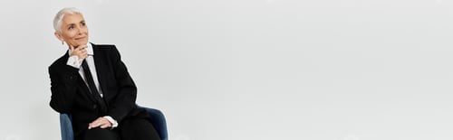 Preview: Elegant Woman Wearing Suit Poses in Studio