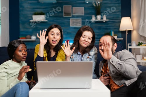 Preview: Happy multi-ethnic friends greeting her collegue during online videocall