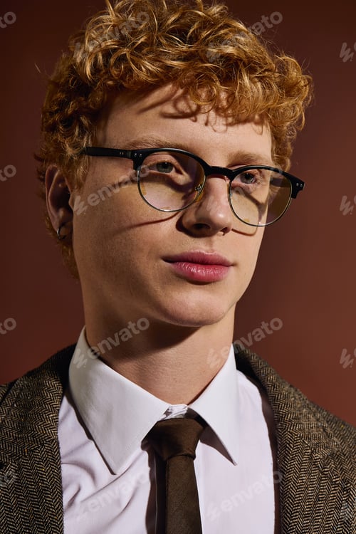 Preview: Stylish young man dressed in classic fashion, capturing the essence of contemporary elegance