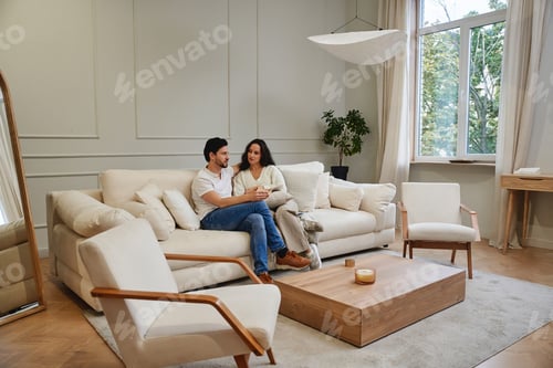 Preview: Cozy couple sharing a moment together in a modern living room