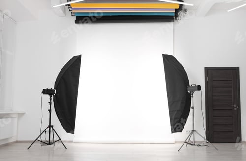 Preview: White photo background and professional lighting equipment in studio