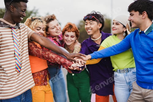 Preview: Multiracial people stacking hands outdoor