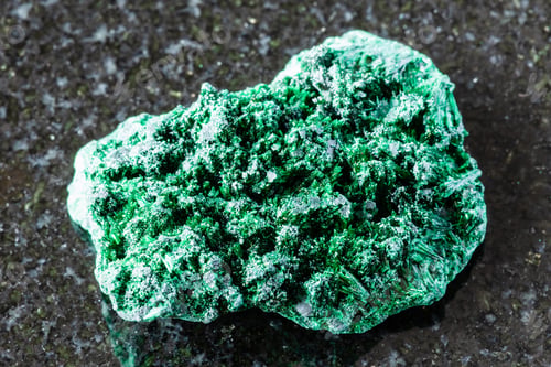 Preview: sample of rough fibrous malachite mineral on black