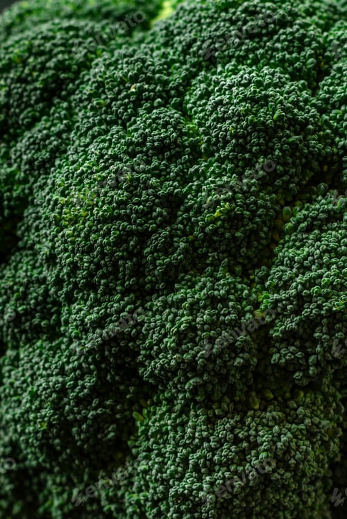 Preview: Raw fresh broccoli on a black home kitchen table