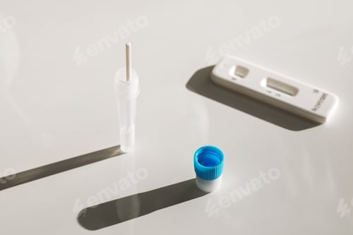 Preview: tablet and covid and disease test kit on a white background