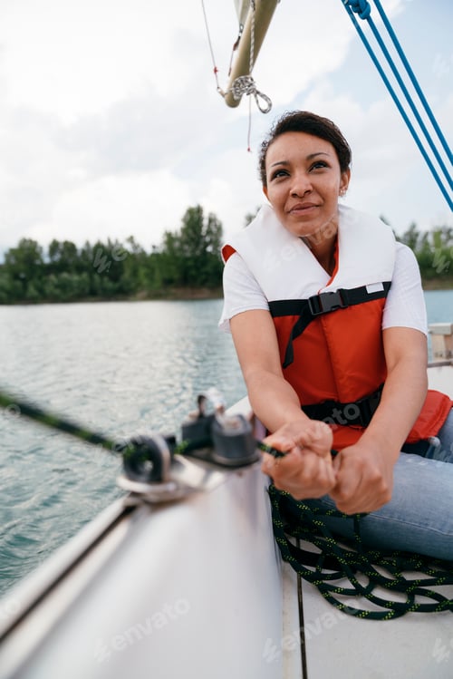 Preview: Woman on sailing boat, steering boat