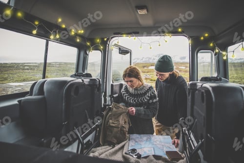 Preview: Couple making a wanderlust vacation, exploring iceland with their 4x4 jeep