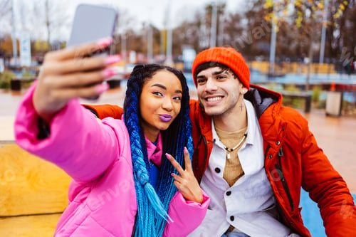 Preview: Multiracial young couple of lovers dating outdoors in winter