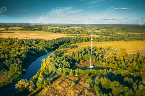 Preview: Telecommunications Cell Phone Tower With Antenna In Countryside. Belarus. Aerial View