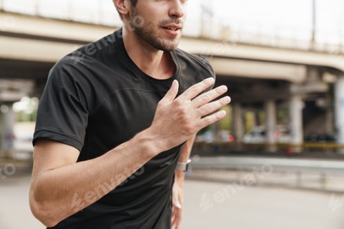 Preview: Image of athletic sportsman running while working out