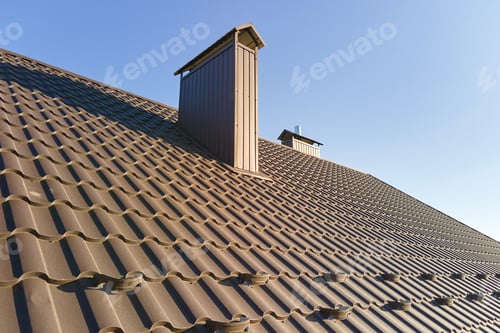 Preview: Closeup snow guard for safety in winter on house roof top covered with steel shingles.