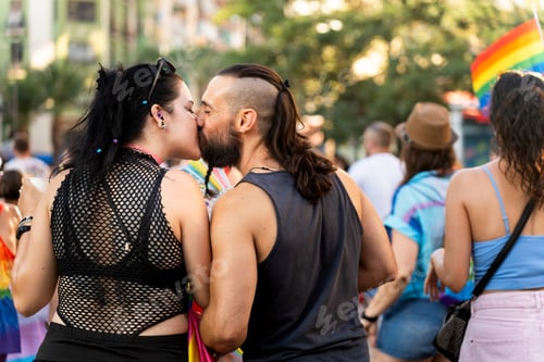 Preview: Couple kissing at pride parade showing love and support