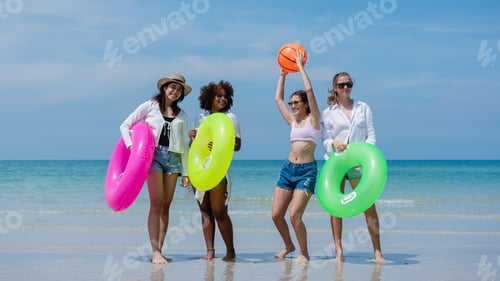 Preview: Happy children laughing and enjoying at beach. Teenage playing with friends at the sea.