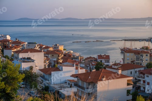 Preview: Sea and houses with red roofs in Greece aerial view