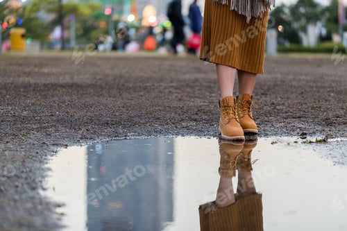 Preview: Woman stepping on the rain drop at outdoor