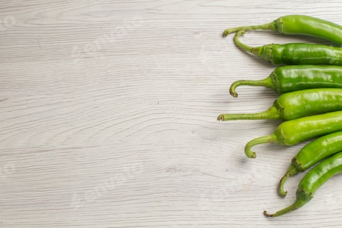 Preview: front view green spicy peppers on a white background color hot edgy vegetable salad photo ripe