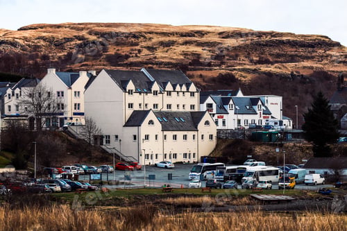 Preview: Scenic town with residential houses and cars in Isle of Skye, Scotland, UK