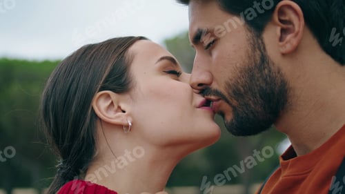 Preview: Cheerful couple kissing nature closeup. Portrait of affectionate lovers on date.