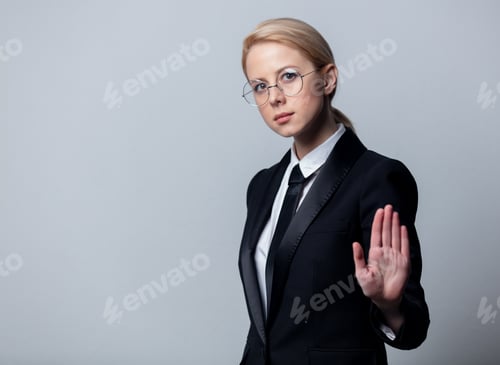 Preview: businesswoman in glasses show stop gesture