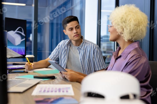 Preview: In modern office, diverse young team discussing work details