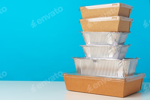 Preview: Assortment of various food delivery containers on table