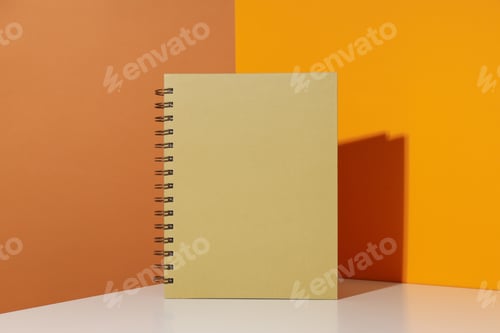Preview: The notebook stands on a yellow background