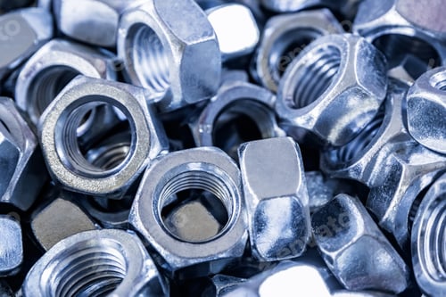 Preview: Closeup of metall nuts abstract industrial background