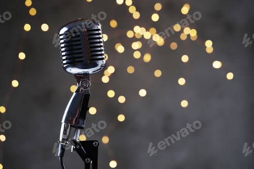 Vintage Microphone Gleaming Against a Bokeh Light Background