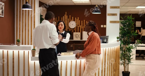 Preview: Receptionist handing contract on tablet