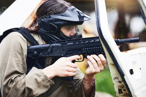 Preview: Paintball, gun or woman in a shooting game playing with fast action on fun battlefield on holiday.