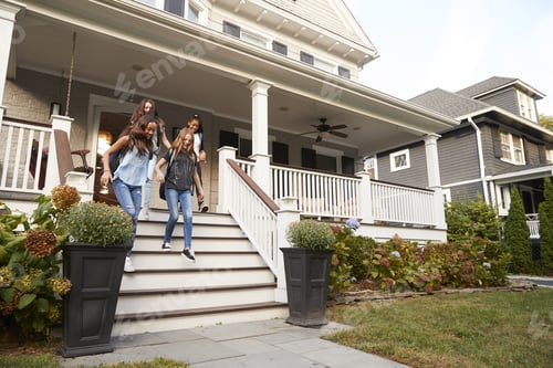 Preview: Four teen girlfriends walking down front steps of house