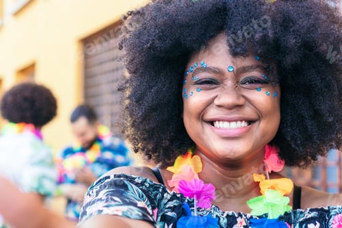 Preview: Latin woman taking selfie at a carnival party in the street