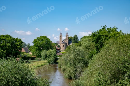 Preview: the church of odilienberg in the netherlands with blue sky in summer