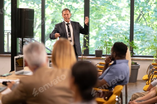 Preview: Cinematic image of a conference meeting.