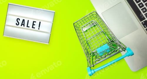 Preview: Miniature shopping cart laptop lightbox , sale concept
