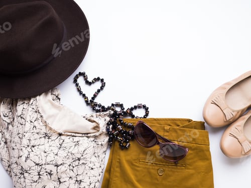 Preview: Flat lay with woman's autumn clothes, glasses hat