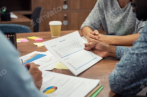 Preview: Businessman reading annual report