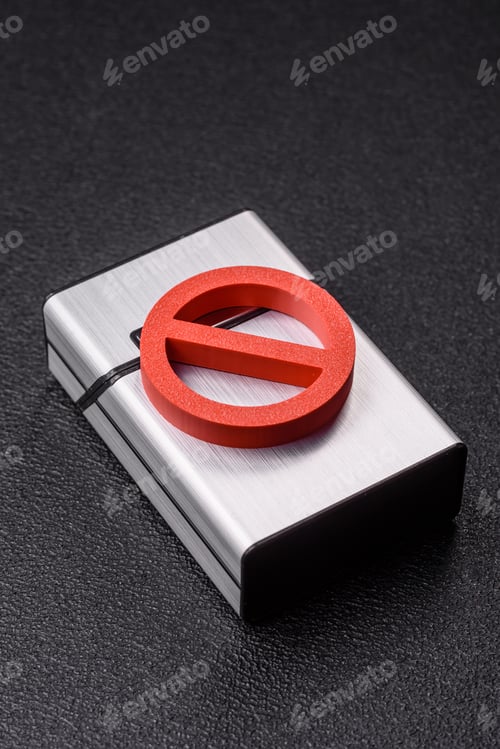 Preview: A metal cigarette box with a no smoking sign depicts a harmful habit. A cigarette box