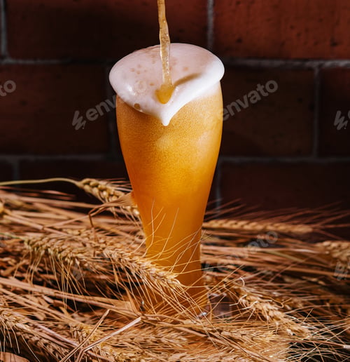 Preview: Pouring beer into glass with wheat ears