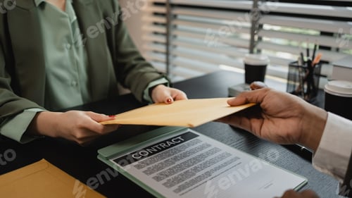 Preview: lawyers looking through client document together