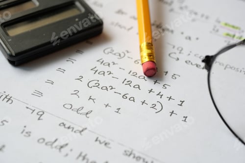Preview: Hand writing algebra equations on a paper