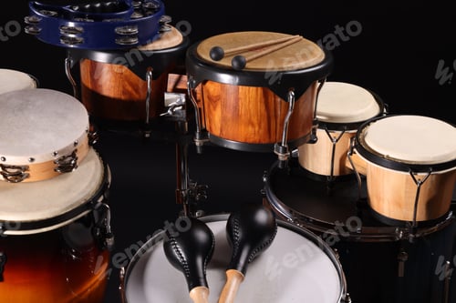 Preview: Different drums on a black background, percussion musical instruments