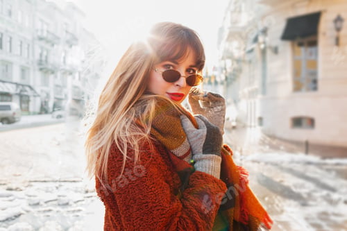 Preview: Close up outdoor winter portrait of pretty brunette woman