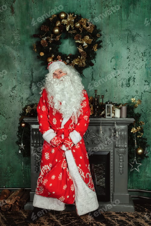 Preview: Portrait of an emotional Santa Claus in decorated living room with Christmas tree