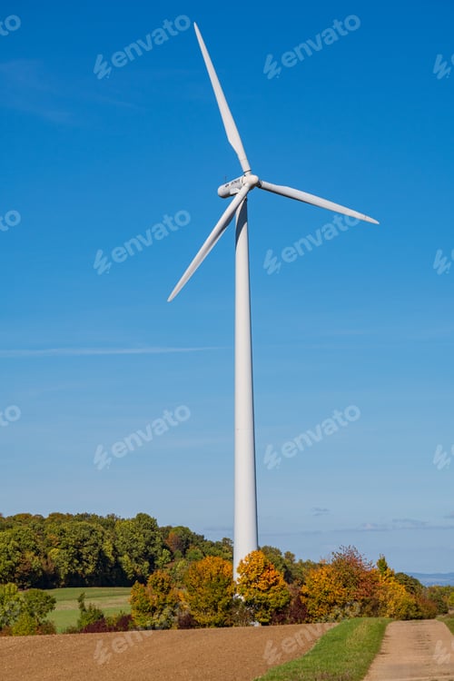 Preview: Wind Turbine against clear blue sky on a sunny day