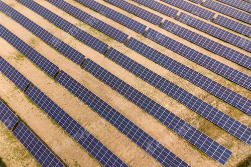 Preview: Aerial view of solar power plant. Electric panels for producing clean ecologic energy.