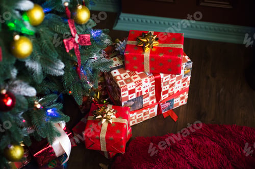 Preview: Christmas tree with gifts at home.