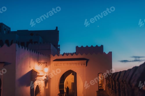 Preview: Building with lamp and blue sky in evening