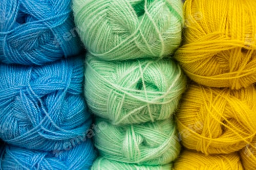 Preview: Many balls of wool yarn for knitting. Selling fluffy threads in a craft store